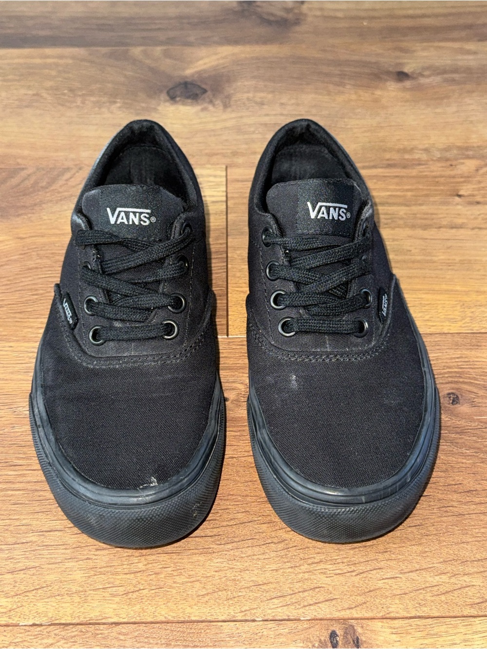 Size 5 women’s/2.5y youth Vans Black Canvas Low-Top Sneakers